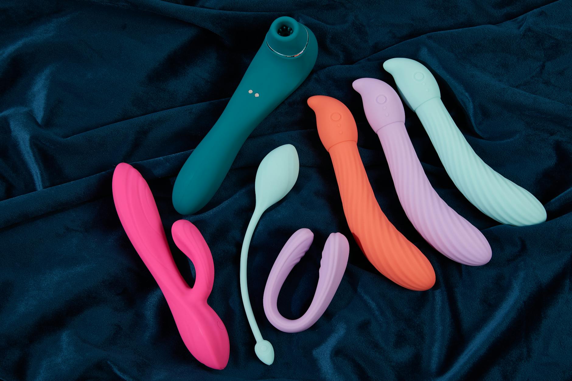 Yellow silicone vibrator surrounded by peeled bananas on a yellow background, representing fresh sensation and pleasure control